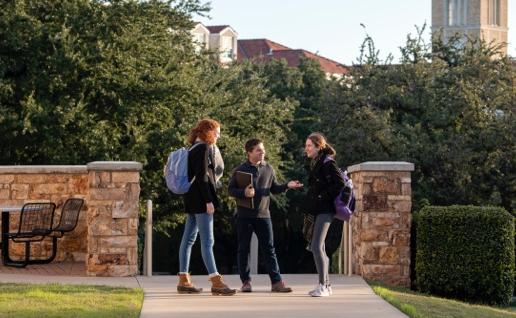 Students stopping to chat on campus